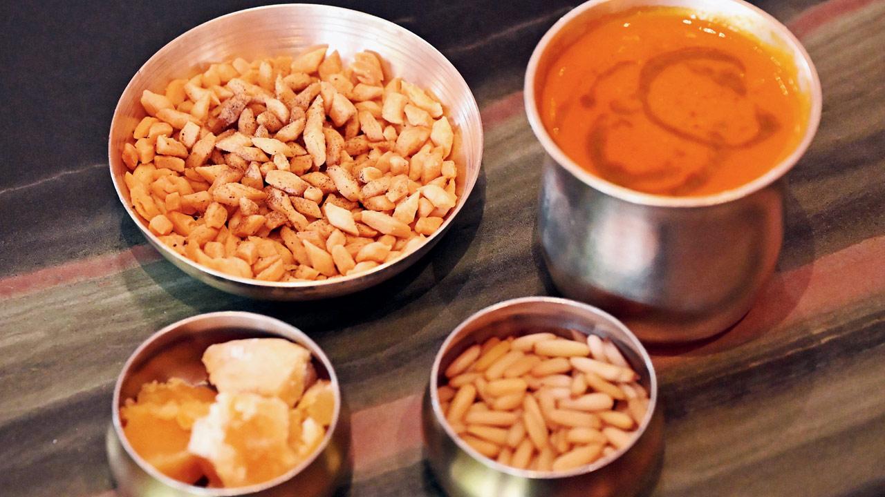 Bhune tamatar aur gur ka shorba served with savoury nimkis (salty snack). Pic/Sayyed Sameer Abedi 