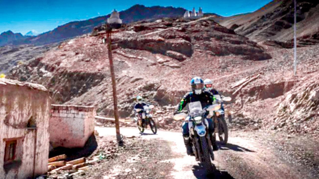 Bikers make their way to the festival site in Stok, Leh
