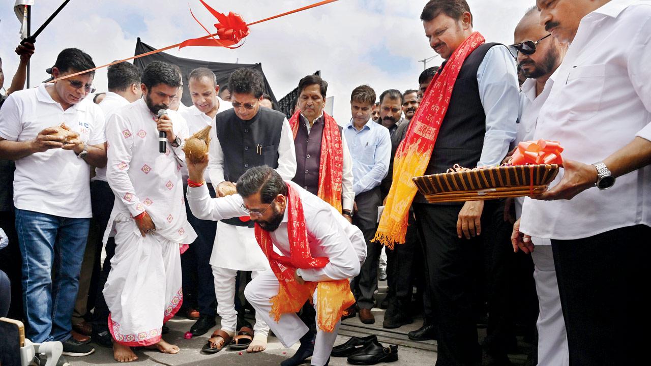 CM Shinde breaks a coconut at the inauguration