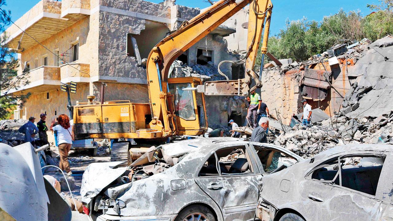 People check destroyed buildings in Lebanon’s Bekaa valley. Pic/AFP