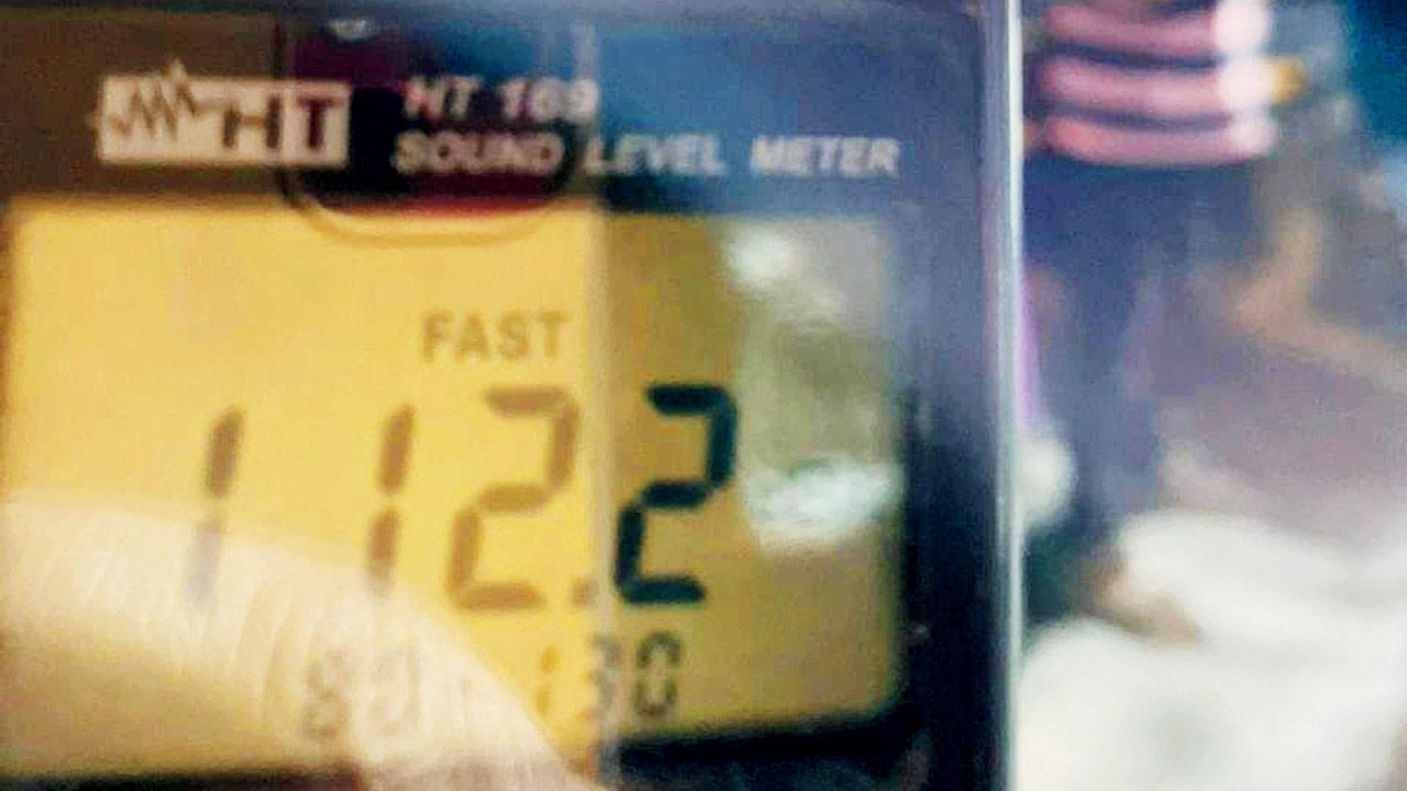 A decibel metre shows noise levels during the Ganesh visarjan reaching over 112 dB