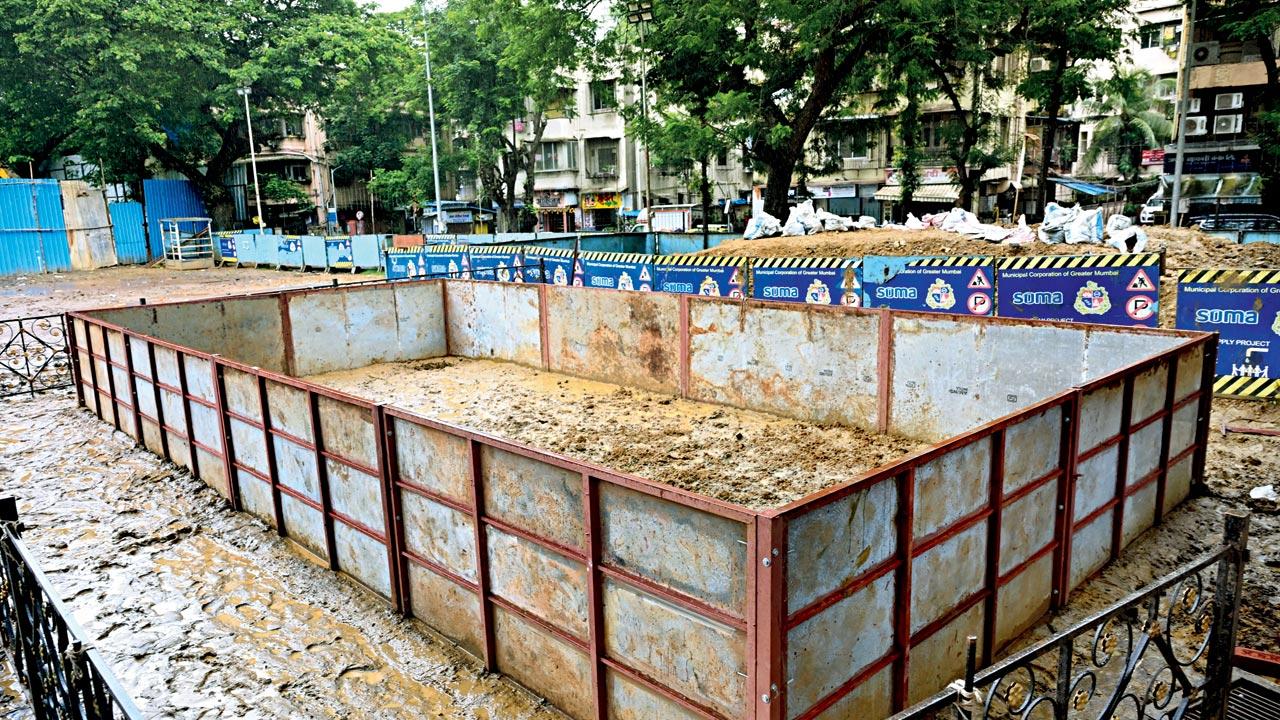 Workers install an artificial pond for the immersion of idols at Bhoiwada market in Parel