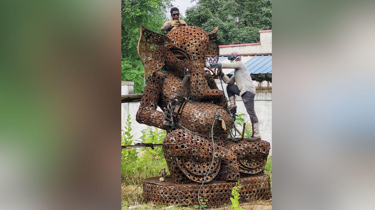 Railway employees craft a 12-feet idol of Lord Ganesha entirely from scrap materials for the upcoming Ganesh Chaturthi festival at the South East Central Railway Wagon Repair Shop, in Raipur.