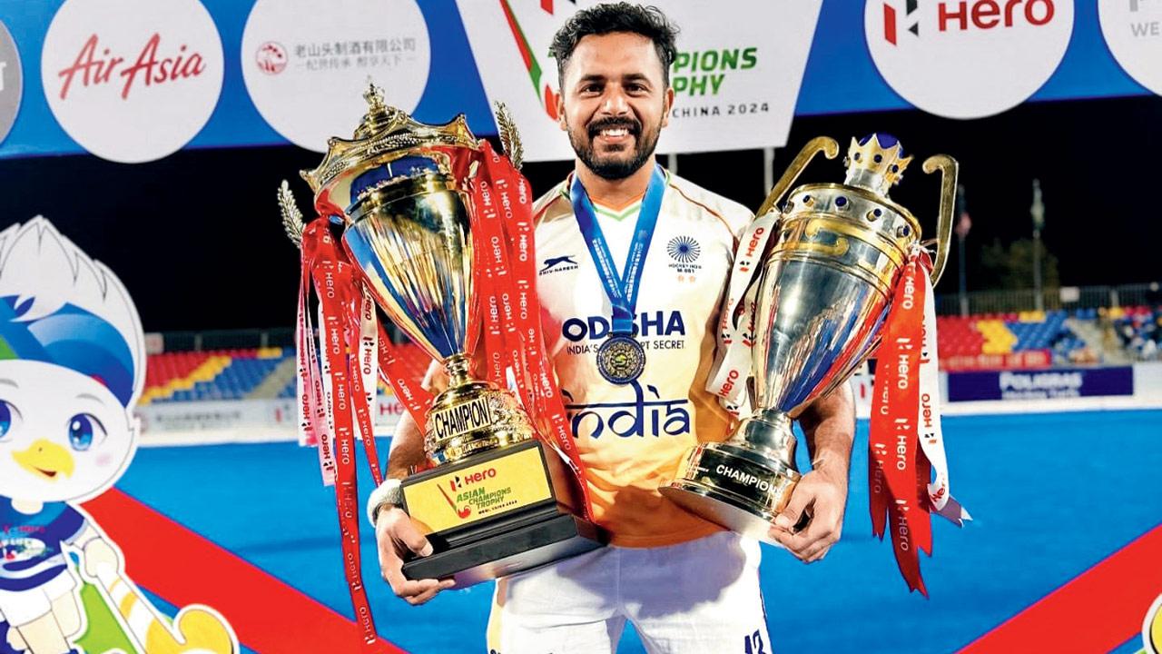 India skipper Harmanpreet Singh with the Asian Champions Trophy and his Player of the Tournament award. Pic/Harmanpreet@Instagram