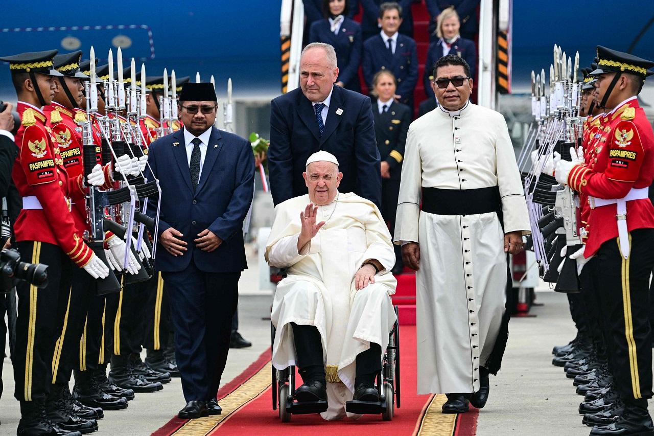 The mosque, the largest in Southeast Asia, sits across a piazza from the capital's main Catholic cathedral, Our Lady of Assumption, and the two are so close to each another that the Muslim call to prayer can be heard during Mass