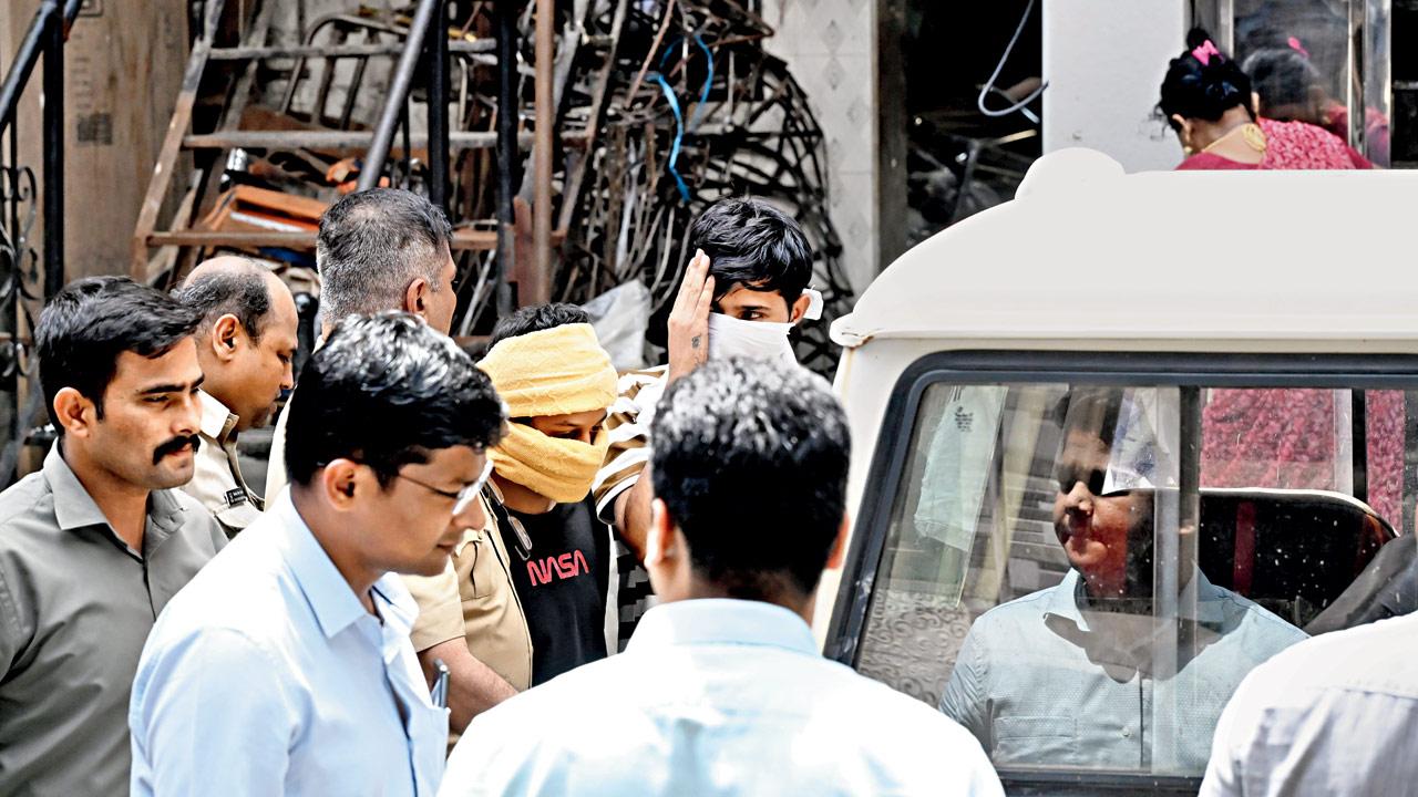 Suspects arrested in connection with the dating app scam being brought out of the Hotel Royal Inn in Goregaon West on September 4. Pic/Anurag Ahire