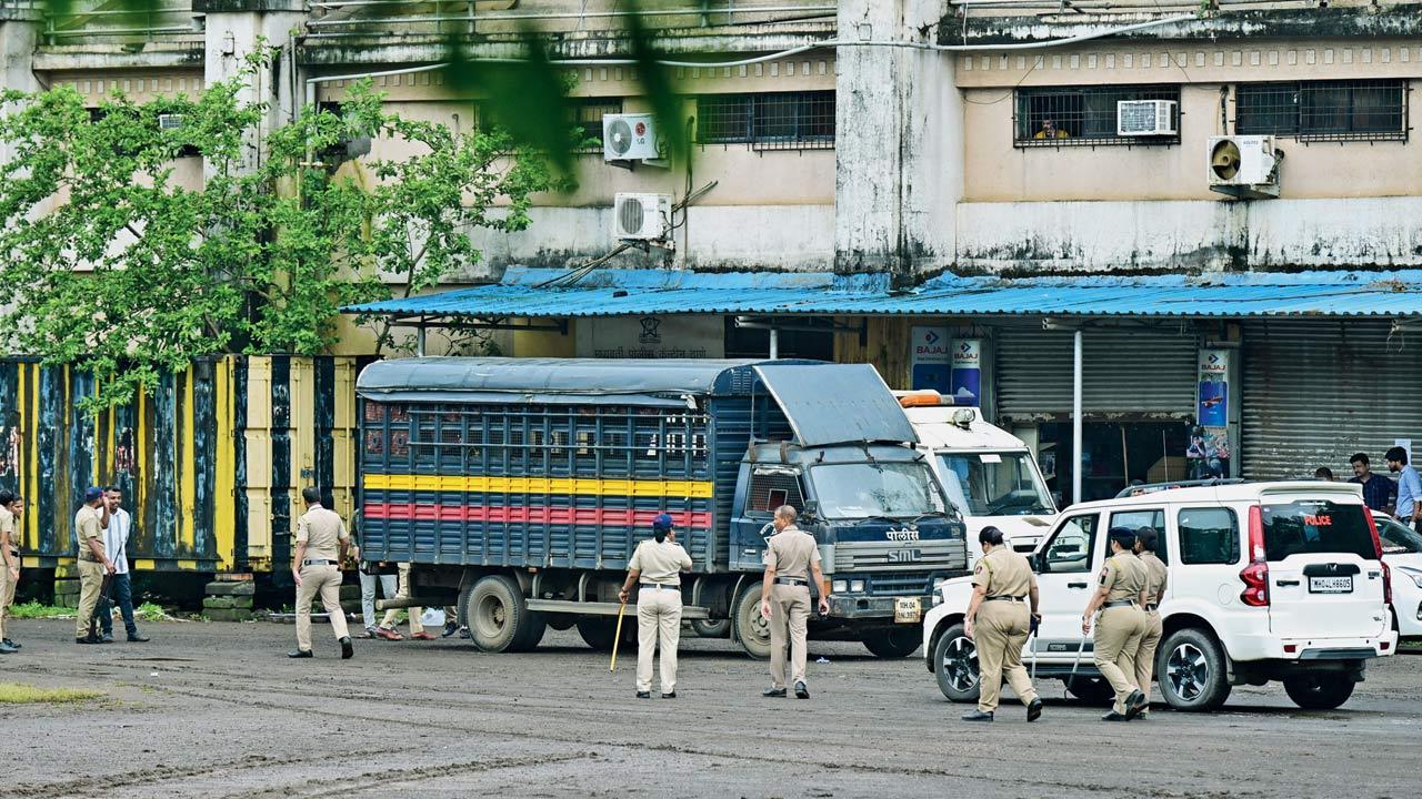 Team of forensic experts and police checking the police van in which Akshay Shinde was allegedly shot dead