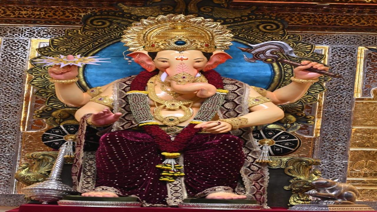 The Lalbaugcha Raja idol was unveiled amid traditional folk dance and song in the presence of hundreds of devotees who gathered to get a glimpse of their favourite deity