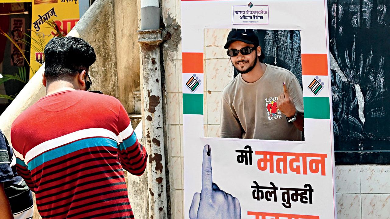A voter posing after casting his vote during the Lok Sabha election in May 2024 in Maharashtra. Pic/Satej Shinde