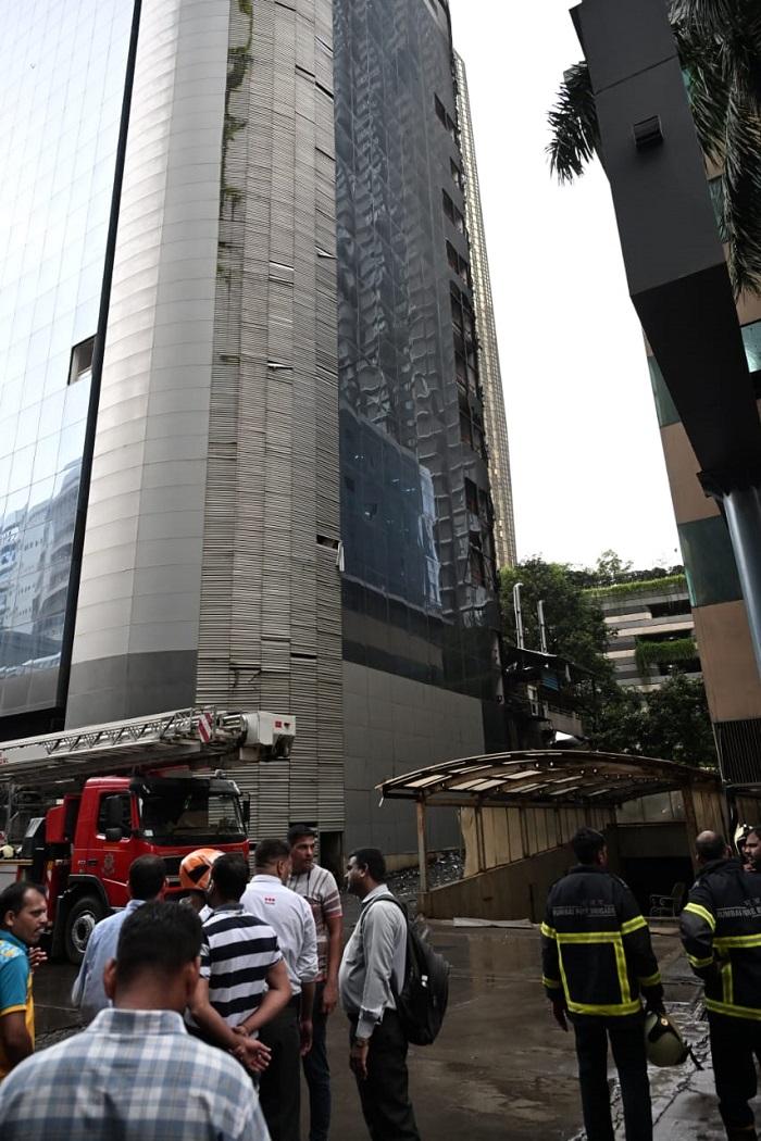 The authorities had initially said that the commercial building had seven floors. They later updated the information, calling it a 14-storey structure