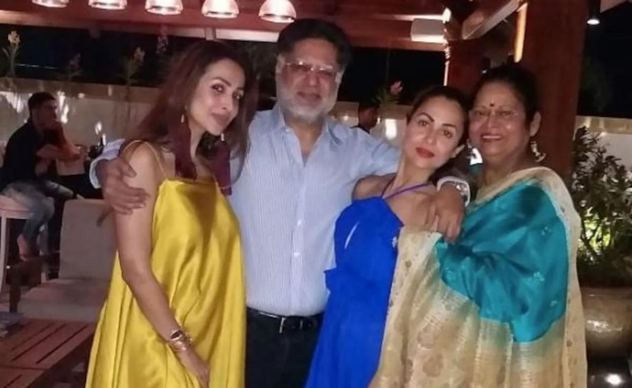 This picture wrenches our hearts as we see Malaika standing close to her father