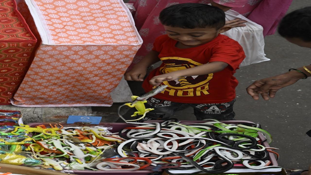 Along with shopping for Bappa, kids pick up toys for themselves 