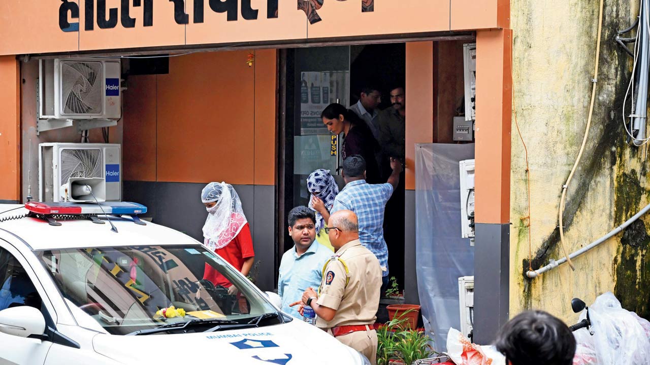 Suspects arrested in connection with the dating app scam being brought out of the Hotel Royal Inn on September 4. Pic/Anurag Ahire