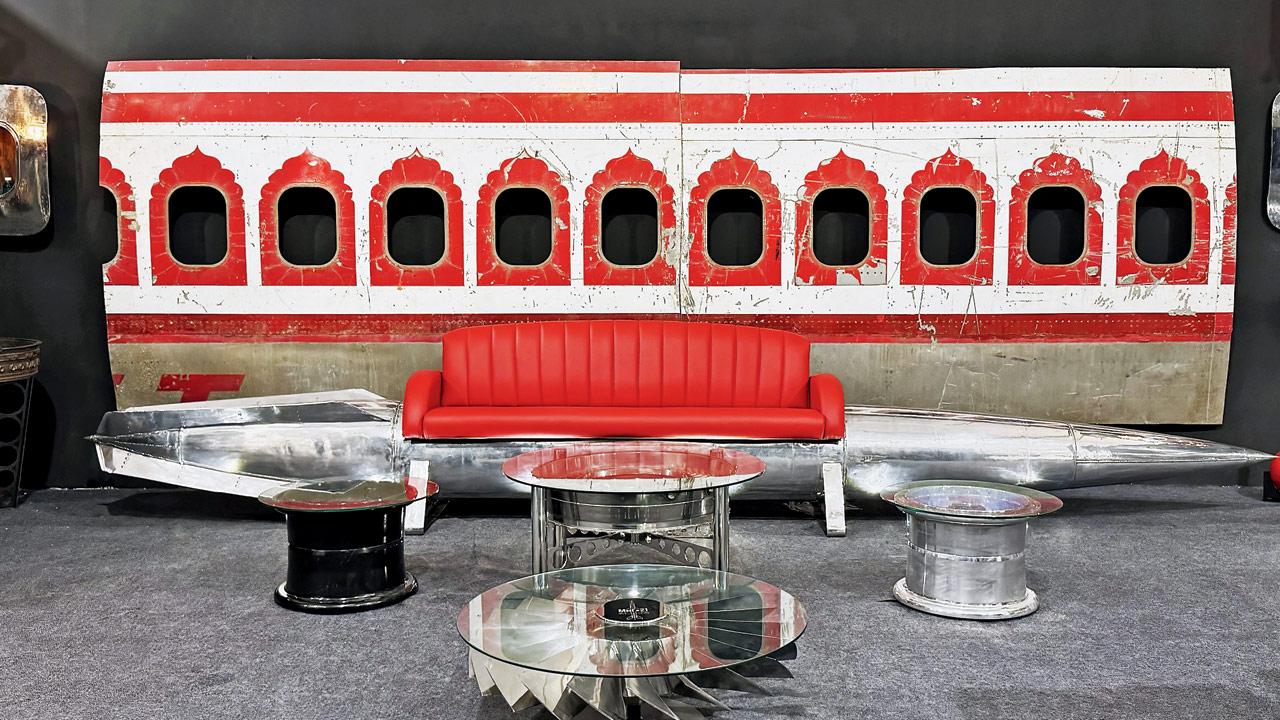 A rare Air India Boeing 747 paint scheme panel; a red Napa leather couch