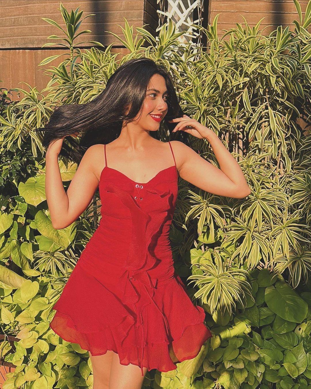 Next is a red-hot dress to elevate your summer look this birthday: In this look, Reem can be seen wearing a strappy red mini dress