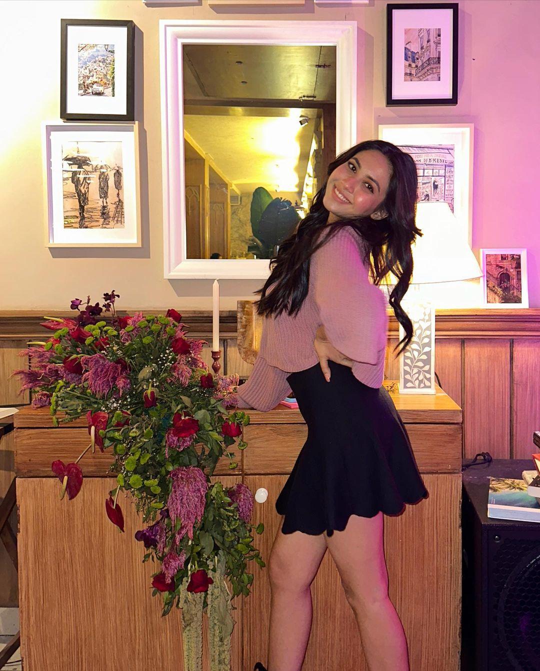 Want to keep it simple for your birthday party? How about a black mini skirt with a light-coloured top? 