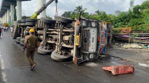 IN PHOTOS: Traffic hit on Ghodbunder Road after truck falls off flyover in Thane