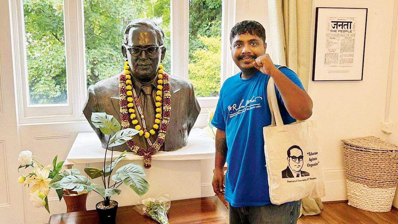 Tushar Adhav poses with a bust of Dr BR Ambedkar at  Ambedkar House in London during the tour  