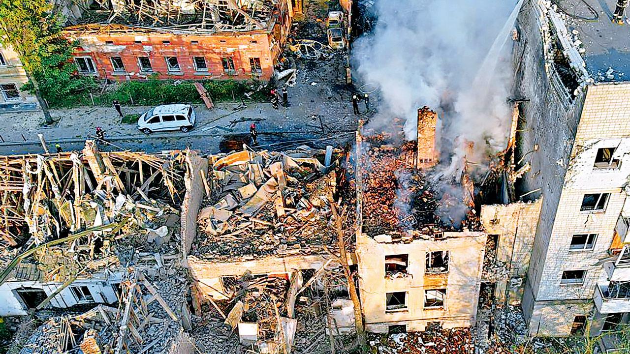 Smoke rises from a building destroyaed by a Russian strike in Lviv. Pic/AP