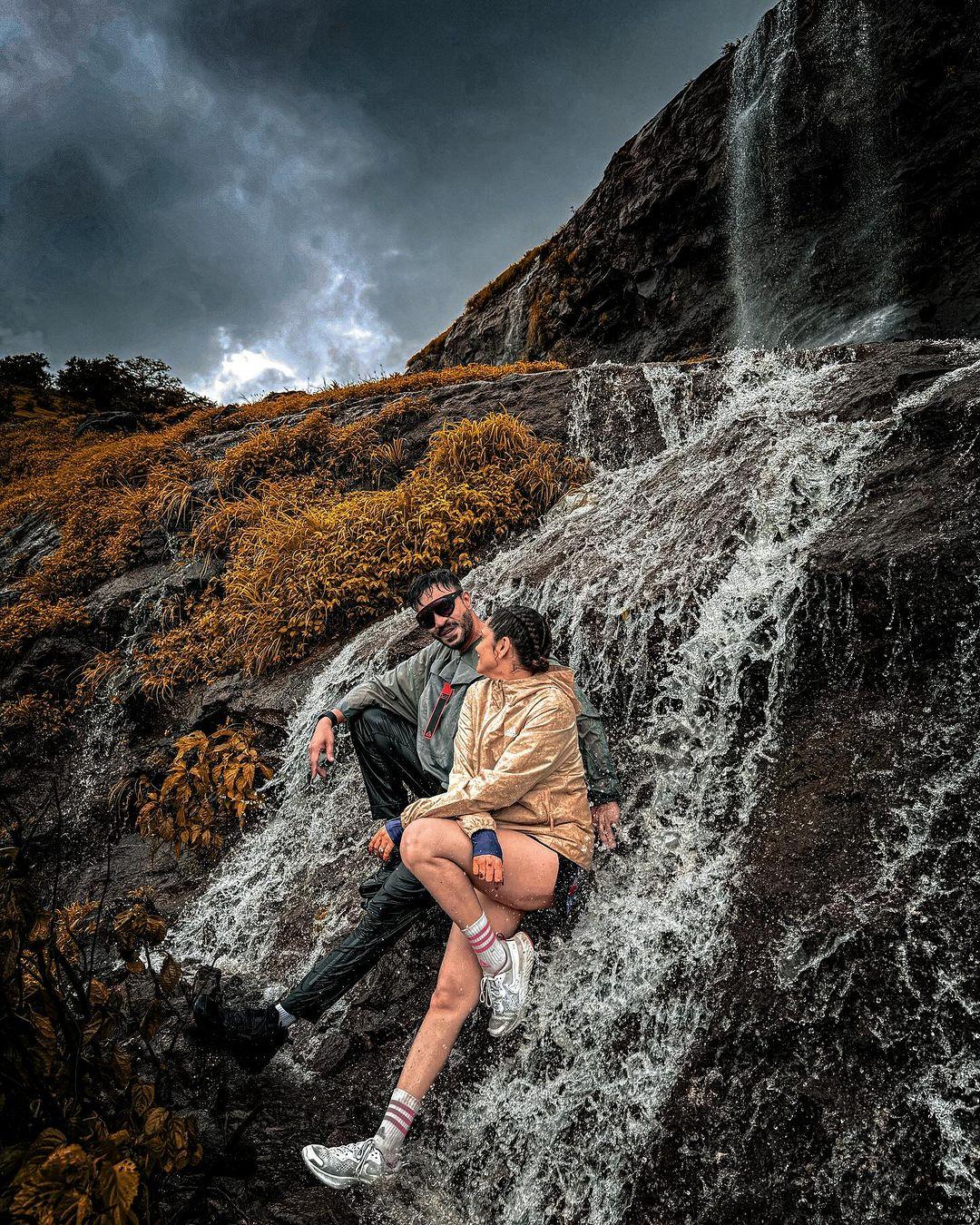 Oh, look at this picture of them posing by a waterfall — uff, this is making us super jealous as we sit in the office and watch them enjoying!