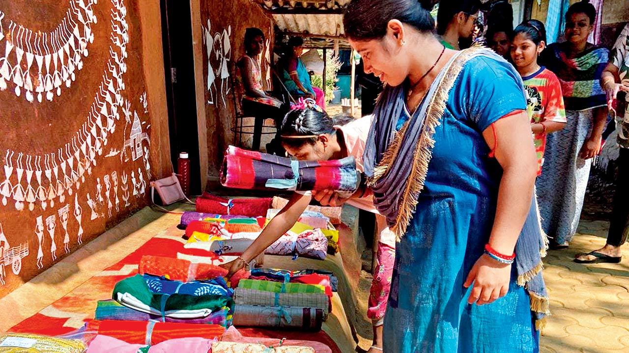 Women of the Warli community select sarees from the collection donated during the previous drive