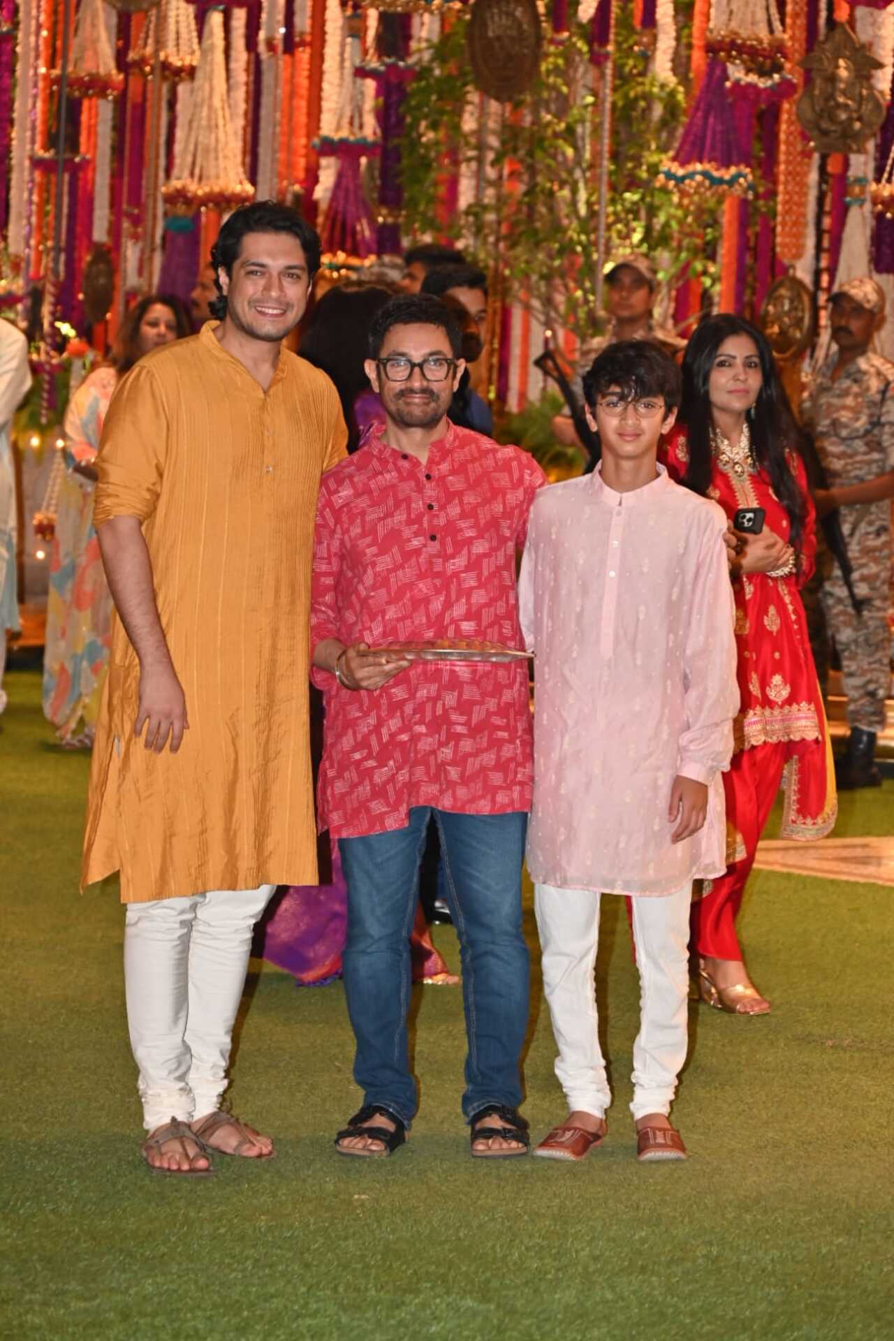 Aamir Khan looks simple in a red kurta. His sons Junaid and Azad have also inherited his simplicity it seems