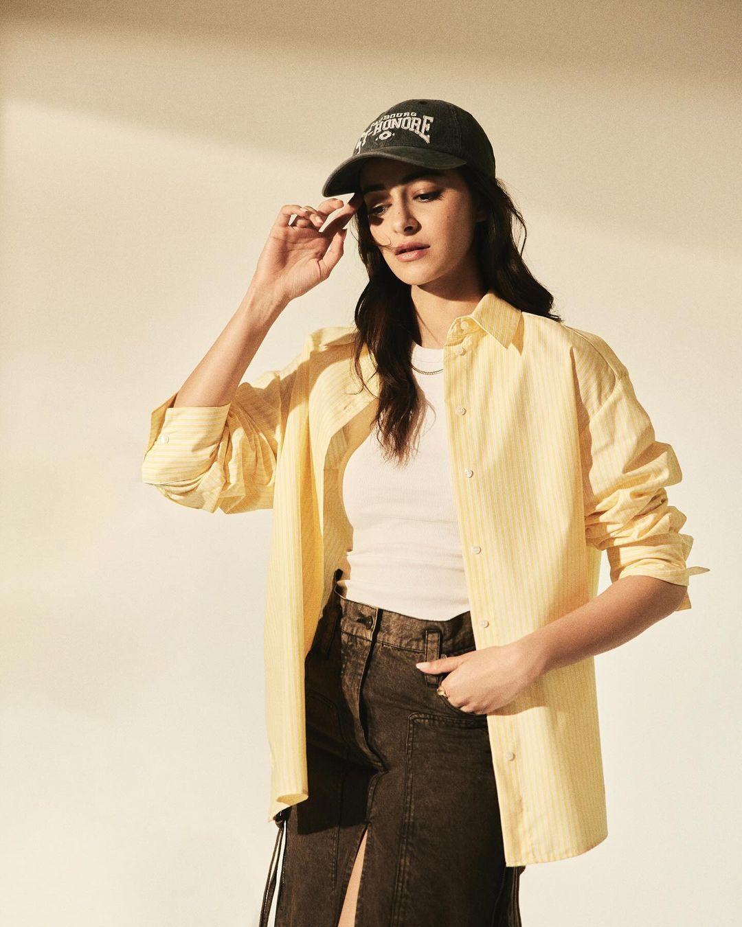 Ananya Panday pulled off a stylish modern look in this yellow and black outfit. She wore an oversized, half-sleeved yellow-lined shirt that gave her look a trendy, androgynous vibe.