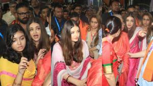 Aishwarya Rai Bachchan navigates through a massive crowd at Mumbai's GSB Ganpati