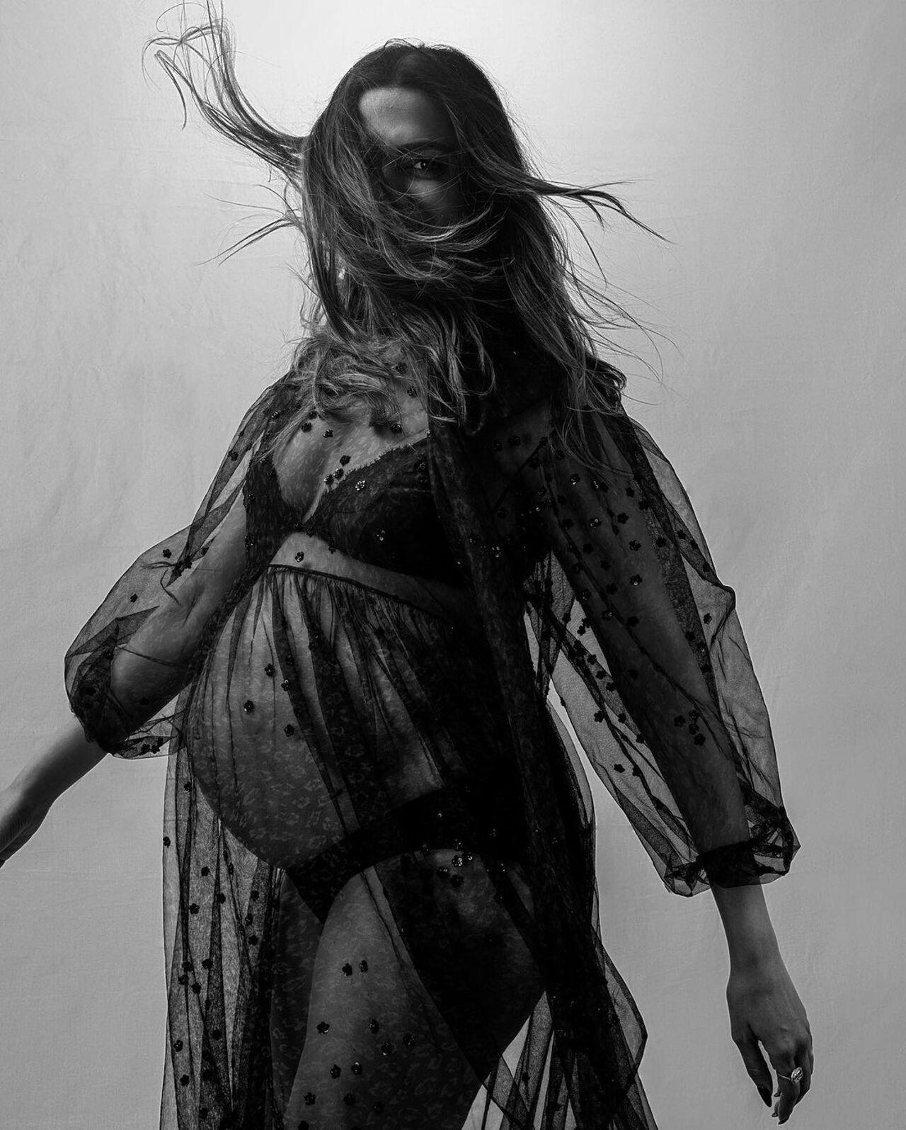 Her natural beauty is only enhanced by this special phase of her life wearing a sheer dress with her bump showing in a few images.