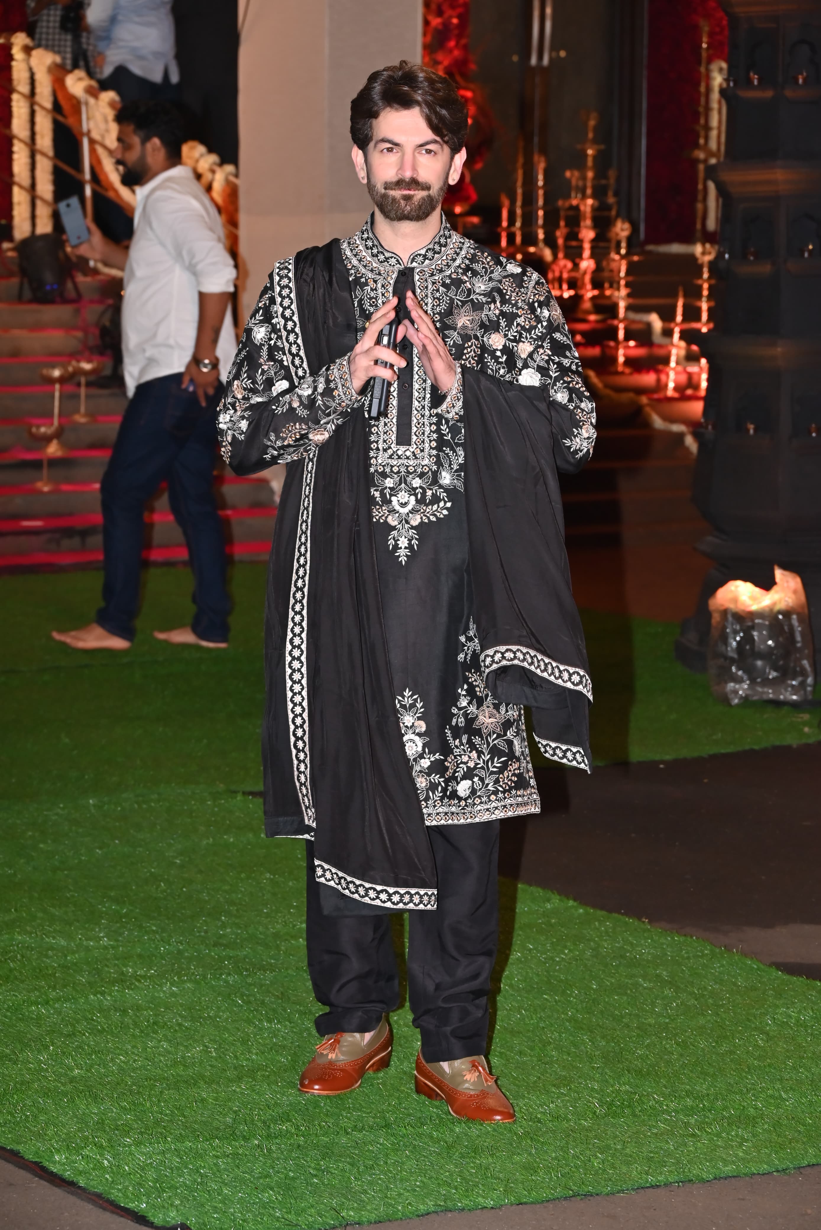 Neil Nitin Mukesh attended the celebration in black sherwani with white embroidery