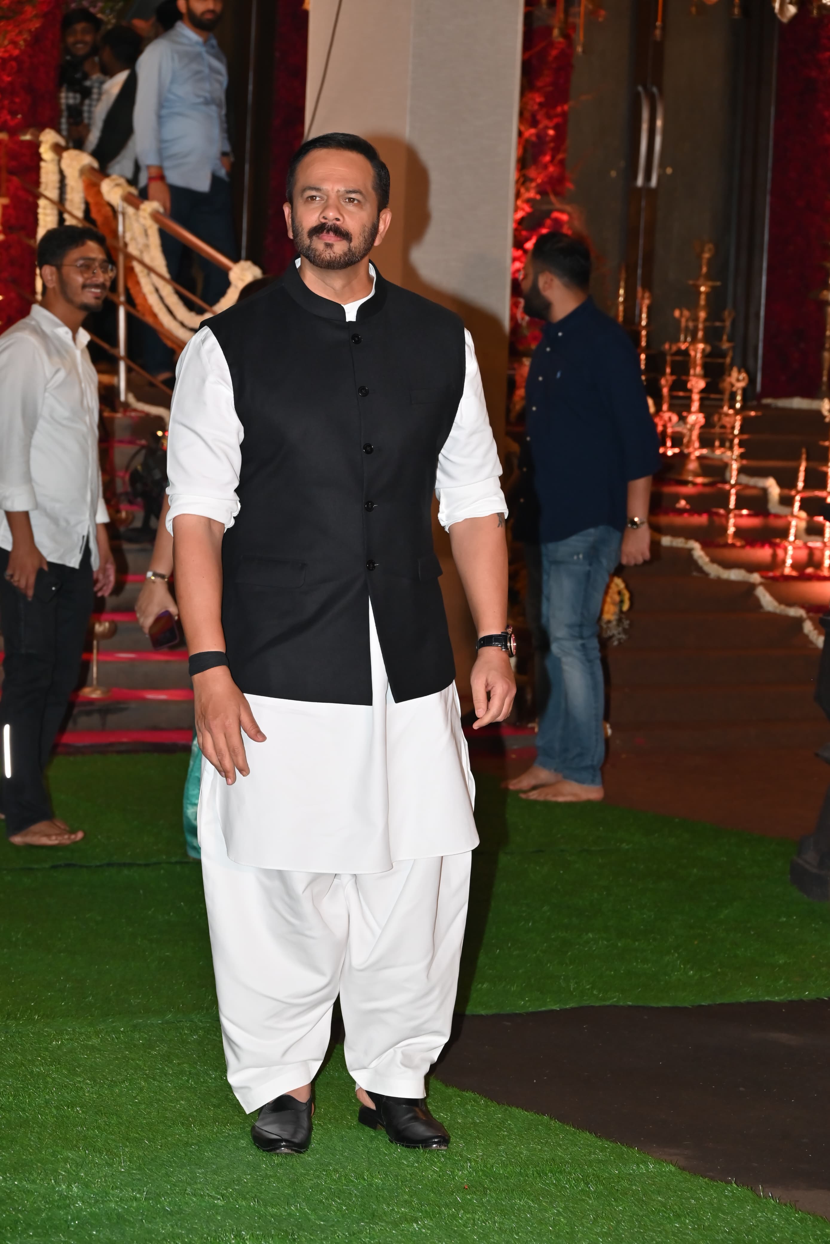 Rohit Shetty opted for a classic white dhoti kurta with black Nehru jacket, as he attended the Ganpati celebration at Eknath Shinde's residence