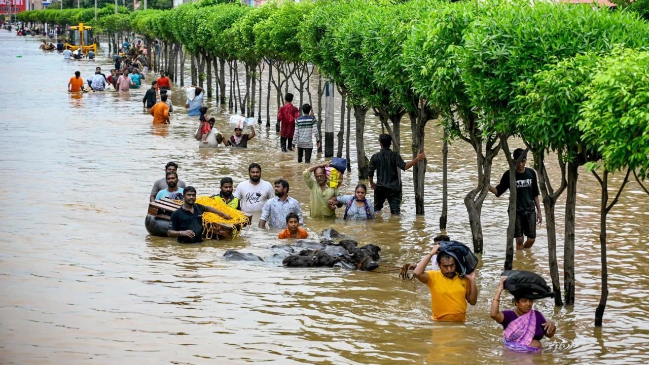 IN PHOTOS: People wade through flooded streets in Vijayawada