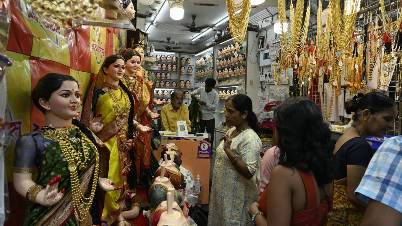 People start by preparing a special Gauri altar at home, decorated with flowers, lights, and traditional artifacts