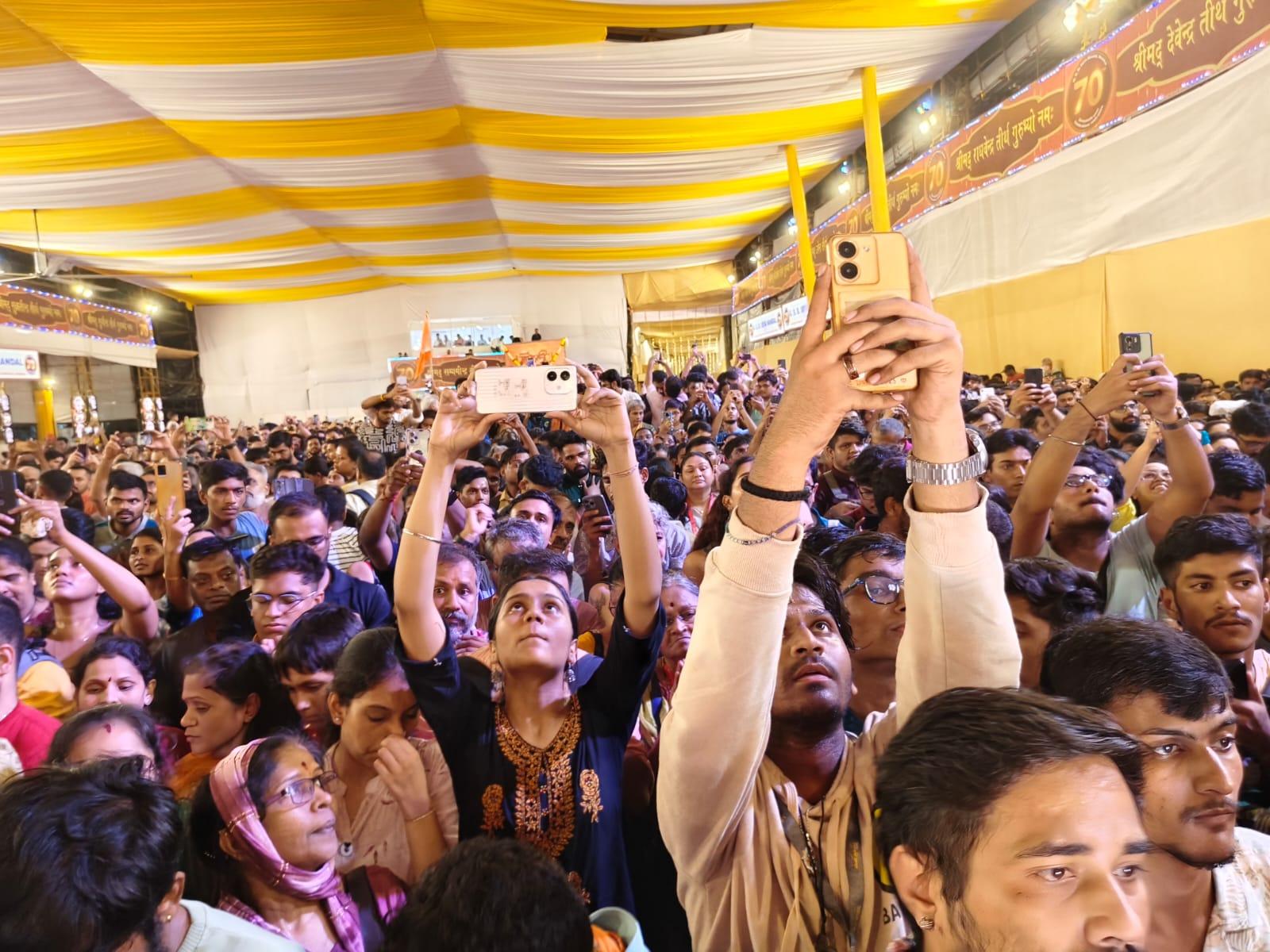 As the idol gets unveiled, devotees take a shot of Bappa on their camera phones 