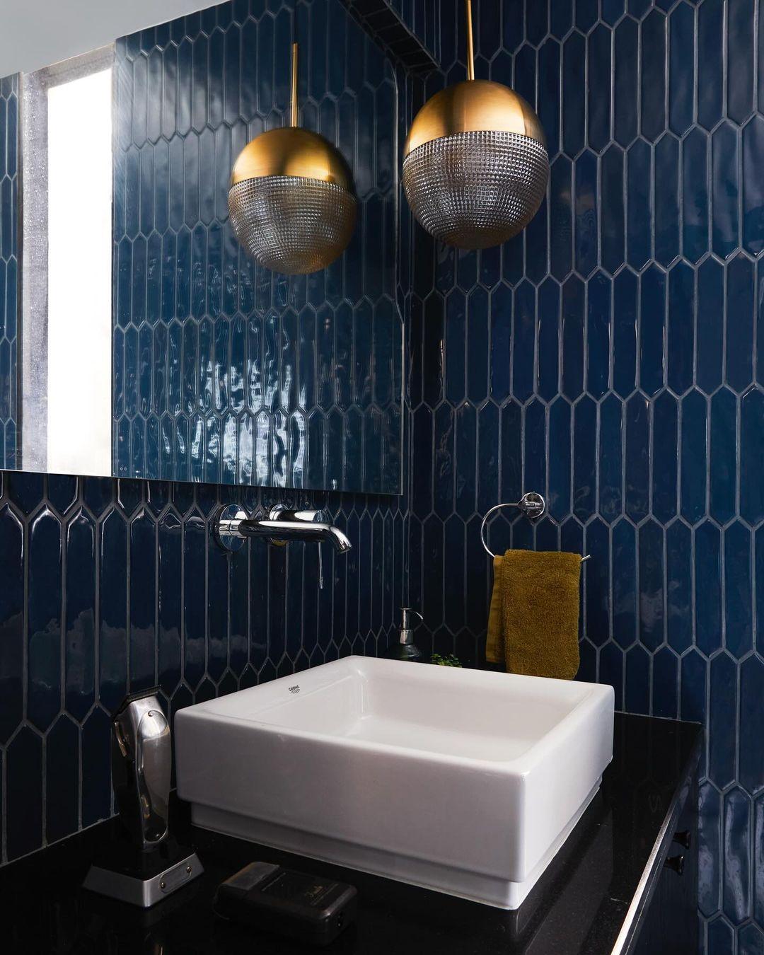 The bathroom is equally striking, with beautiful Egyptian blue tiles that bring a sense of luxury without being overly flashy.