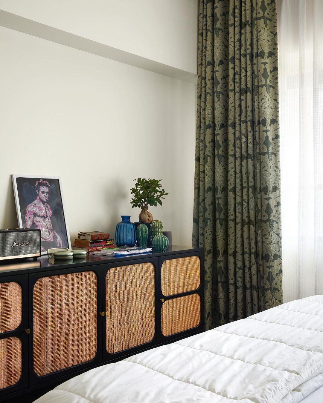 The interior decor features earthy tones and vintage posters, creating a nostalgic yet modern vibe, with plenty of comfortable corners to relax in.
