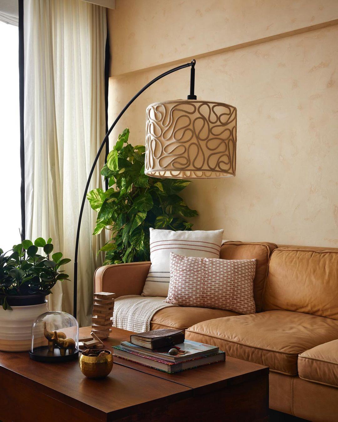 The apartment has a warm and lived-in feel, with decor choices that are inviting and perfectly suited to Ishaan's personality, giving it a welcoming and personal touch.