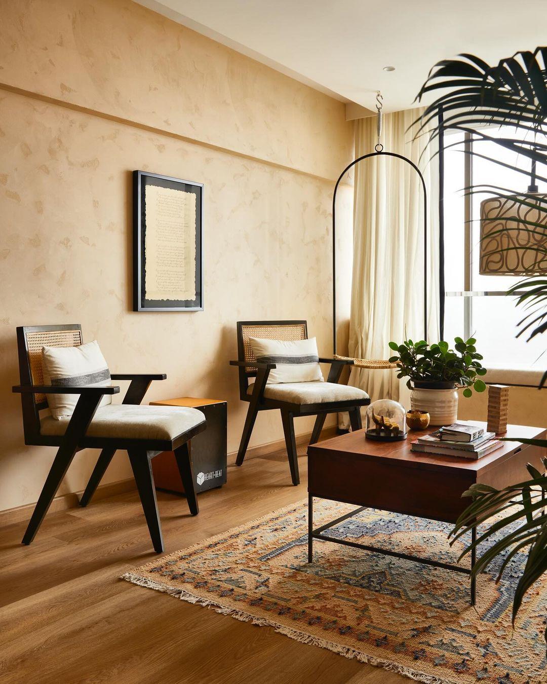 The bright, sunlit living room is a standout feature, with large windows that flood the space with natural light, creating an open and airy atmosphere.