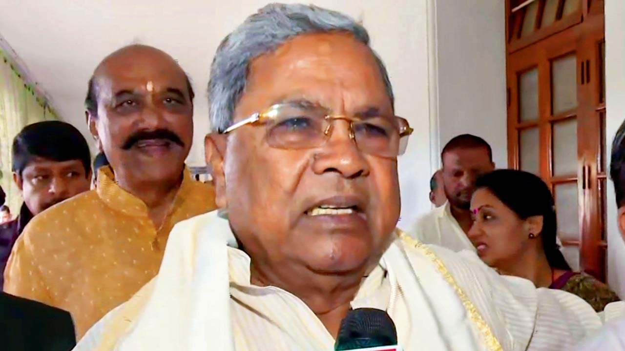 Karnataka CM Siddaramaiah talks to the media. Pic/PTI