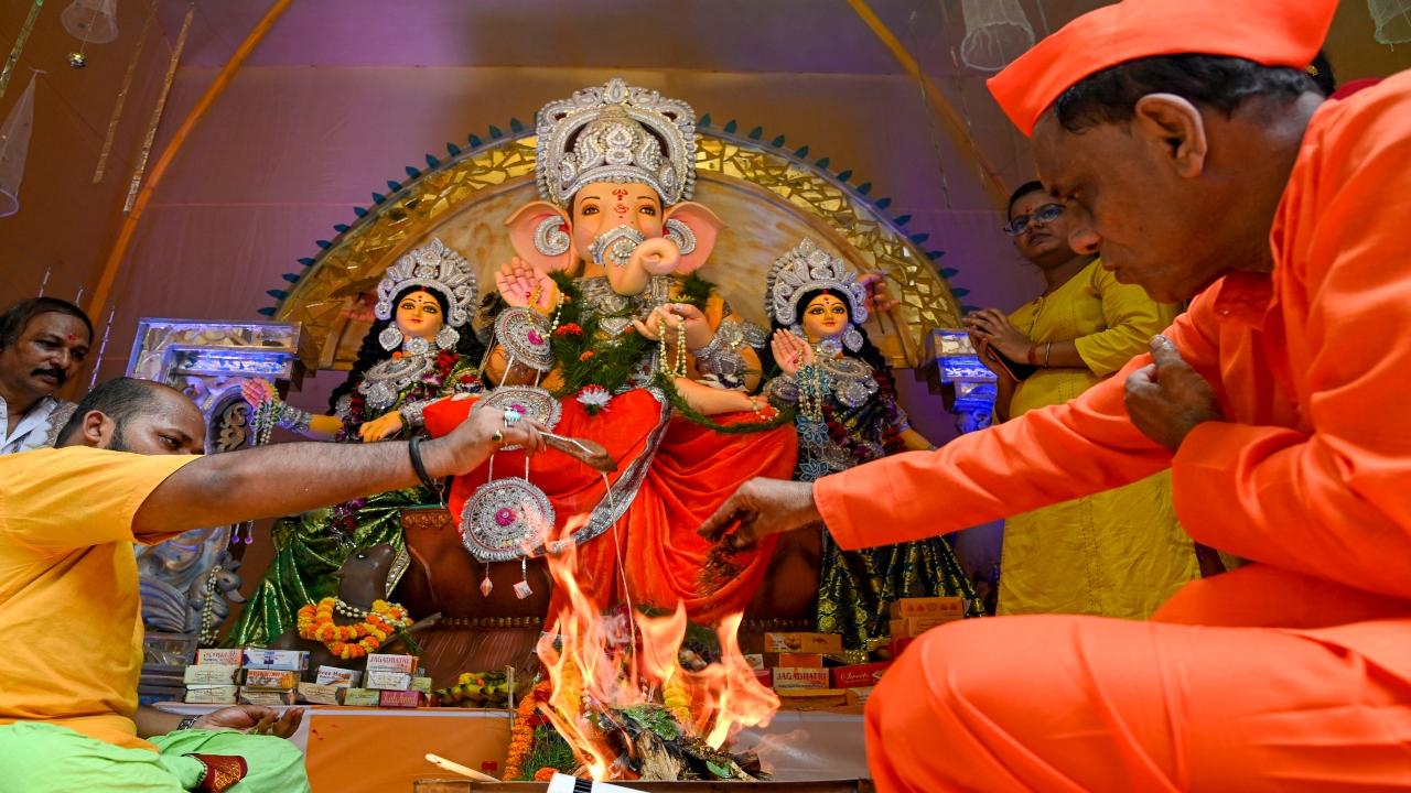 In Kolkata, devotees are performing a havan in a Ganesh pandal on the occasion of Ganesh Chaturthi