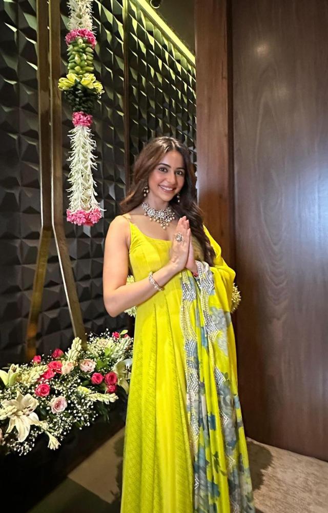 For the auspicious day, Rakul opted for a neon green anarkali suit and traditional jewellery