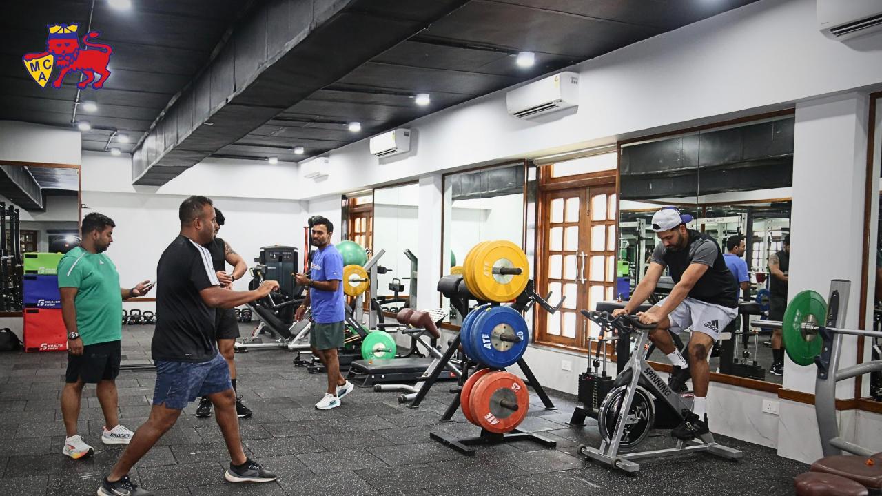 In one image, Team India's skipper is seen cycling at the gym