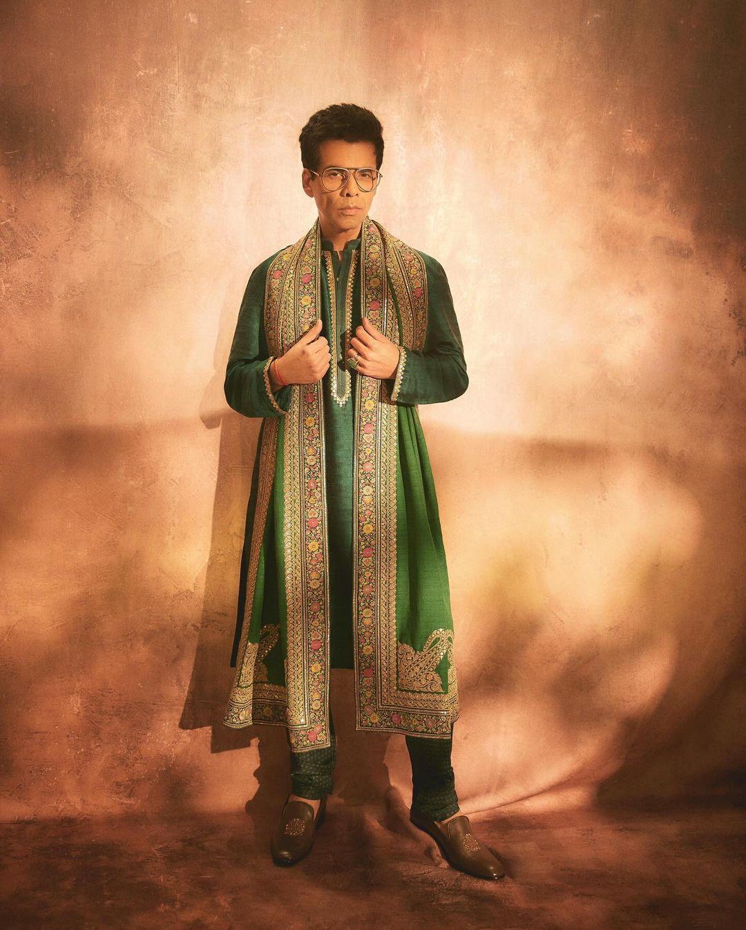 Karan Johar, who was a part of the grand, star-studded celebration, chose to wear Sabyasachi for the day. He opted for a green kurta paired with a matching overcoat featuring intricate designs