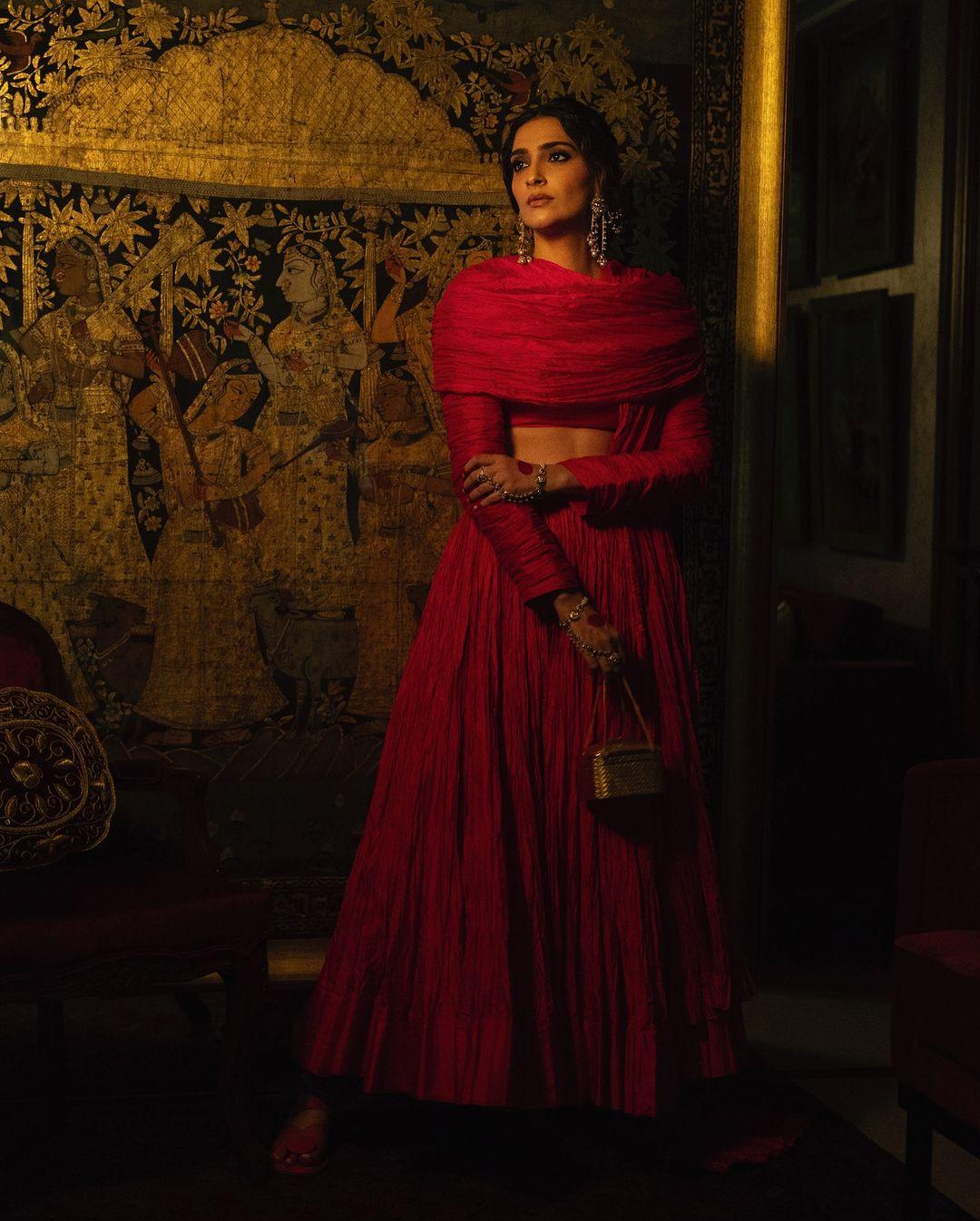 Draped in vibrant red and adorned with the elegance of alta, Sonam Kapoor dazzled in an Abu Jani Sandeep Khosla creation. The actress styled her hair in a stunning updo adorned with intricate and beautiful jewellery