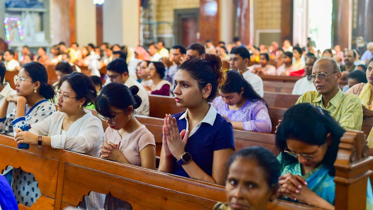 Christians offer prayers during a mass at St. Joseph's Cathedral in Prayagraj
To celebrate, people attend the Easter Mass, offering prayers and greeting each other.