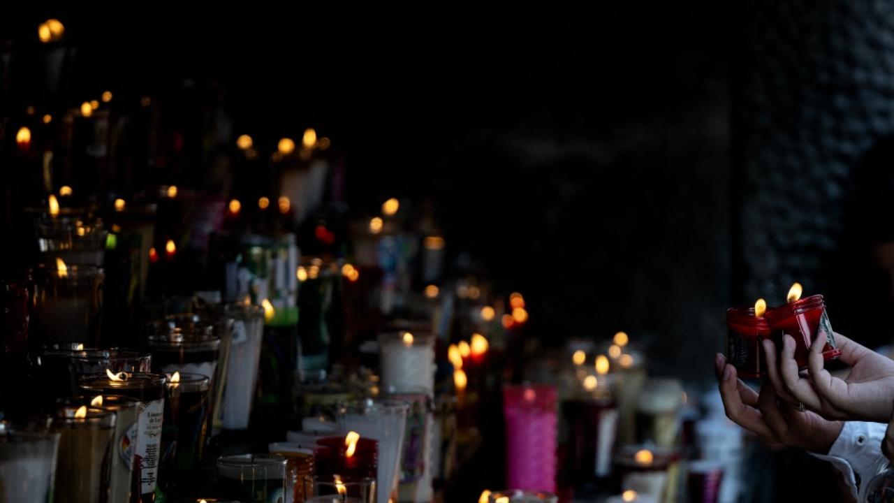 Churchgoers lit candles at the Basilica de Guadalupe in Mexico City during a church service for the death of Pope Francis