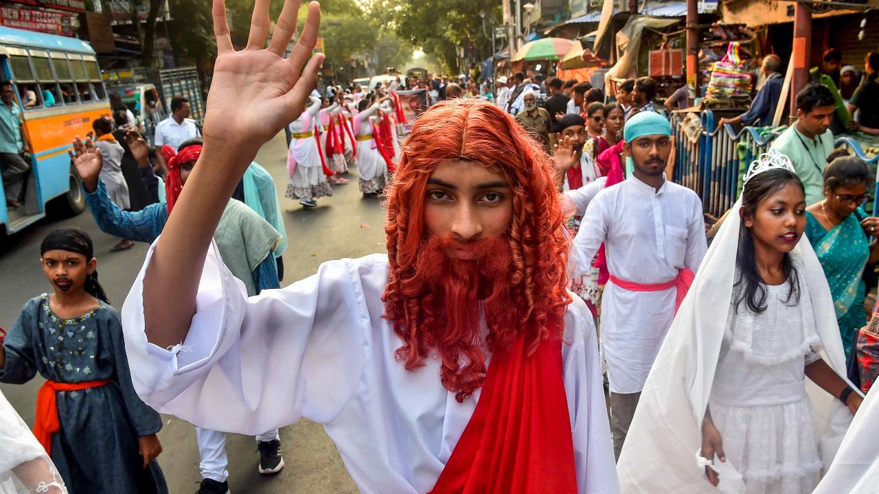 People from the Christian community take part in an Easter rally in Kolkata
Easter rallies and processions are also held in several parts of the country. Apart from these, feasting forms an important part of Easter celebrations.
