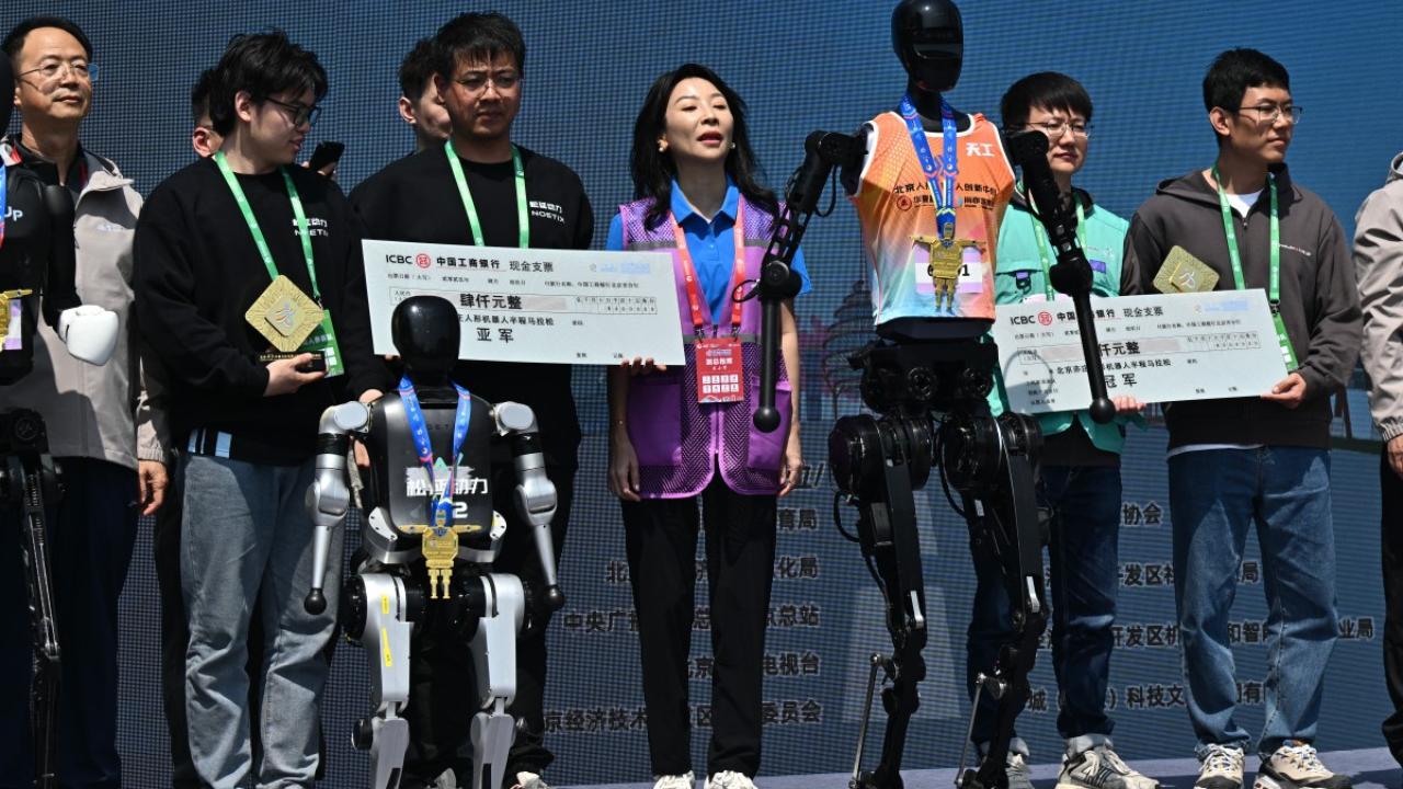 Crossing the finish line first despite a mid-race fall was the tallest droid and one of the heaviest in the competition. At 5.9 feet tall and weighing 52 kilograms, the metallic black 