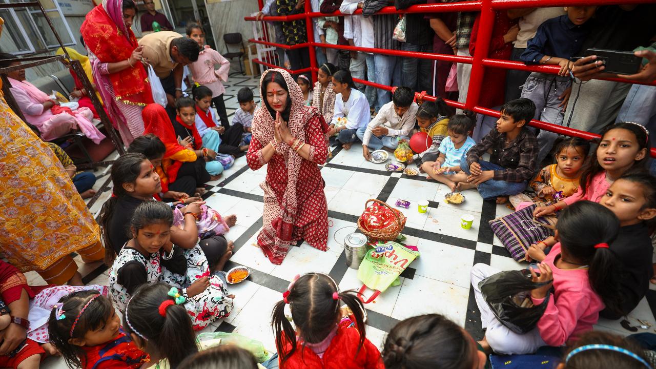 Devotees perform 'Kanjak Puja' at the Kali temple in Jammu
The girls are offered traditional delicacies like puri, chhole, and halwa, along with other gifts.