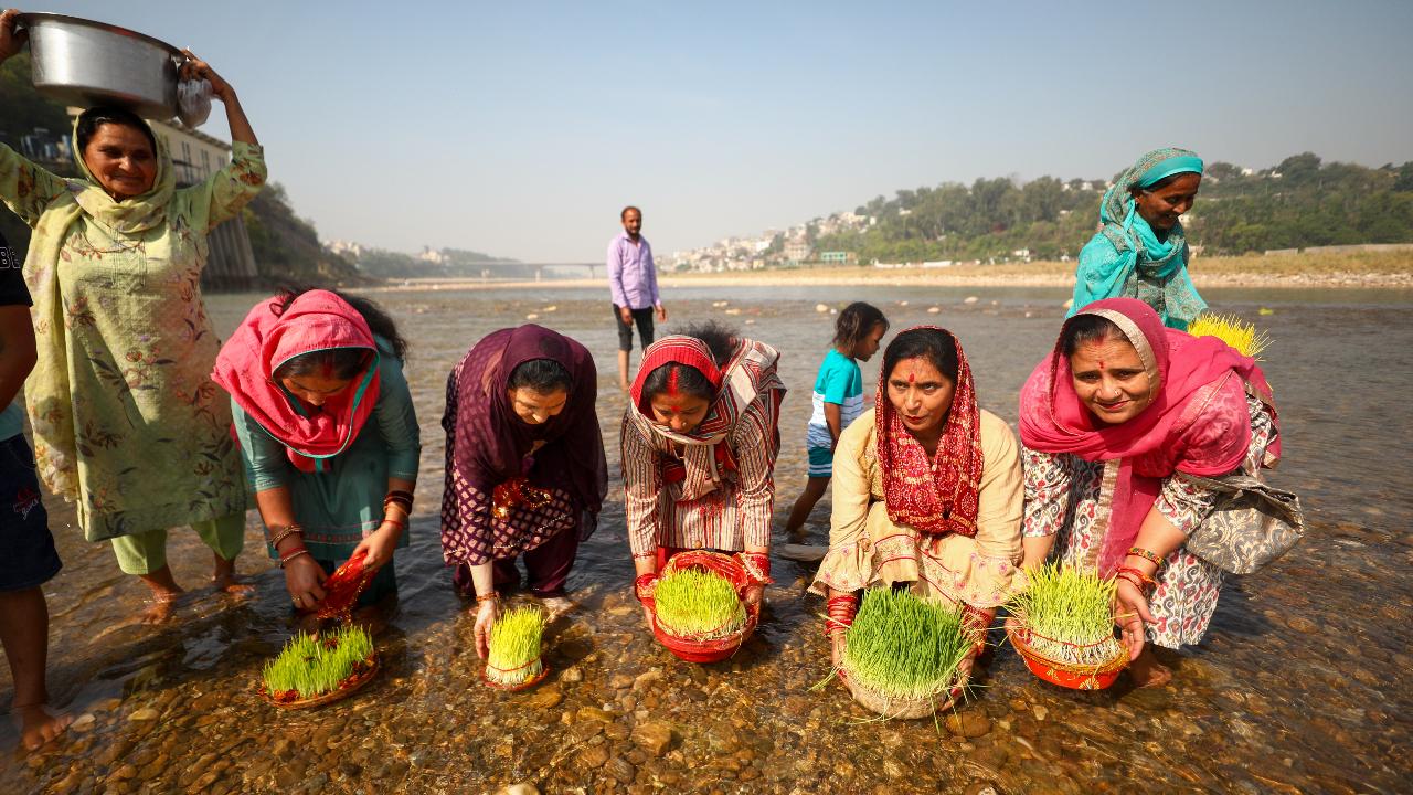 Women immerse 'barley saplings' grown during Navratri festival at Har Ki Pauri Ghat of River Tawi in Jammu
Other Ram Navami and Navratri rituals were also observed across the country.